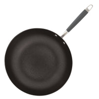 A non-stick frying pan with a black surface and a long handle featuring a grey grip. The pan is viewed from above, showing a smooth cooking surface and two rivets attaching the handle to the base.