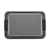 A rectangular, non-stick baking tray with black silicon handles on each side. The tray has a shallow depth and a smooth surface, suitable for baking or roasting. Placed on a plain white background.