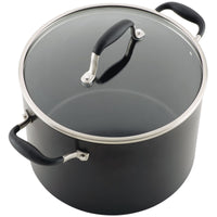 A large black cooking pot with a glass lid and stainless steel rim. It has two black handles on the sides and a matching handle on the lid. The pot is designed for stove-top use, ideal for cooking soups, stews, or large meals.