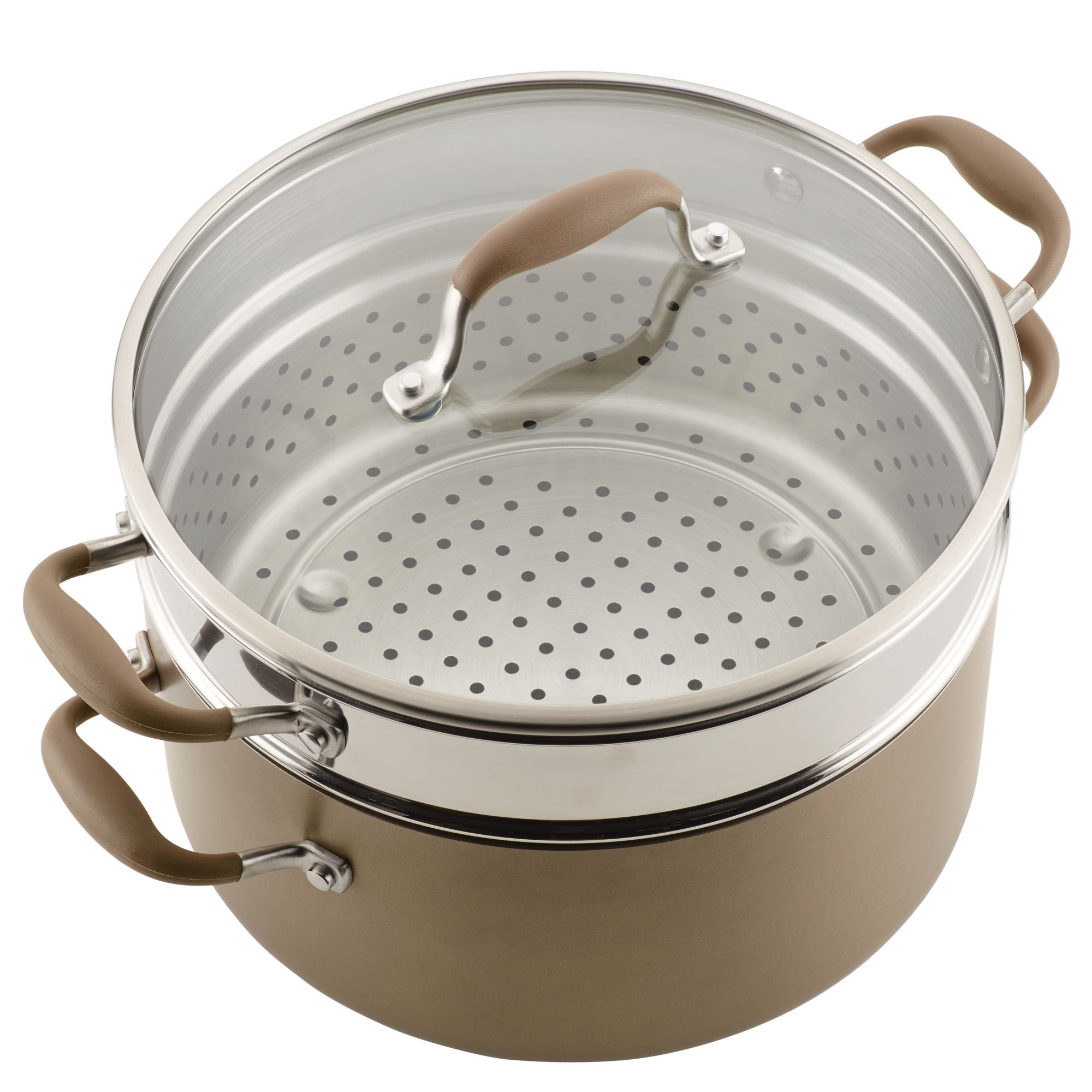 A metal steamer pot with a glass lid, featuring brown handles, is shown. The pot has a perforated insert for steaming and is placed on a solid base.