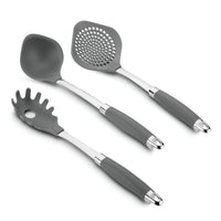 A set of three kitchen utensils with gray handles: a solid spoon, a slotted turner, and a pasta server. Each has a metal accent near the handle. The utensils are arranged on a plain white background.