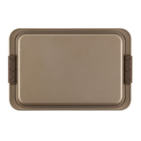 A rectangular brown bakelite tray with rounded edges and two handle grips. It has a simple, smooth design and appears to be made of a durable material. The tray is photographed from a top-down angle against a white background.