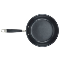 A black non-stick frying pan with a shiny stainless steel handle and a black grip, viewed from above. The pan is empty and has a smooth, flat cooking surface.