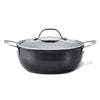 The Anolon X 4-Quart Hybrid Nonstick Casserole Pan features a sleek black design with durable nonstick coating, metal side handles, and a stainless steel base. It comes with a clear glass lid that has a metallic handle.