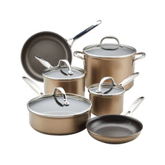 The Ascend 10-Piece Hard Anodized Nonstick Cookware Set, featuring a sleek bronze design and metal handles, includes two frying pans, three pots with accompanying lids, and a sauté pan. Each piece is crafted from hard-anodized aluminum for durability and is induction compatible for versatile cooking options.