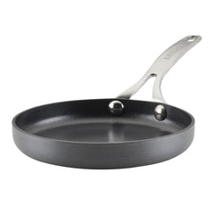 Introducing the 6.25-Inch Mini Frying Pan by SPECIALTY, this stylish cookware item combines a sleek, modern design with a glossy silver handle against a white background. The frying pan boasts hard-anodized construction for lasting durability and features a nonstick finish with a smooth, flat cooking surface ideal for everyday culinary creations.