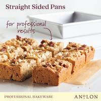 Image of a 9-inch aluminized steel square cake pan with several pieces of nut-topped cake displayed in front. Text reads: Straight Sided Pans for professional results and durable heat conduction, Professional Bakeware Pro-Bake.