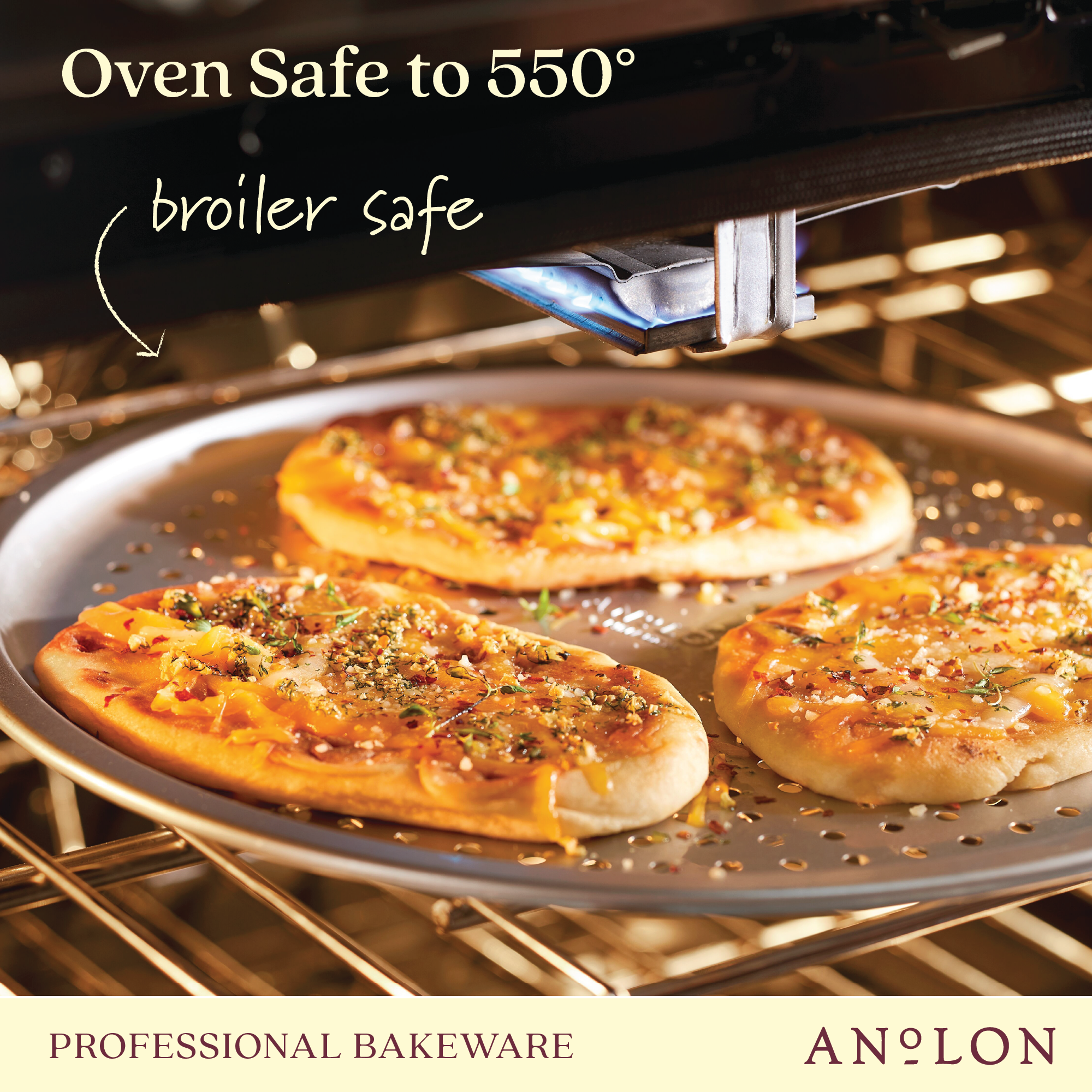 Three thin crust pizzas loaded with cheese, herbs, and toppings are baking on a 14-Inch Aluminized Steel Perforated Pizza Pan inside an oven. The text on the image states that it is oven safe up to 550° and broiler safe. The Pro-Bake brand logo is featured alongside the term Professional Bakeware.