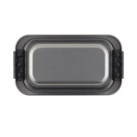 The Advanced 9 x 5-Inch Loaf Pan with silicone grips features heavy-gauge steel, a gray nonstick surface, and black silicone handles on both ends, shown from above against a white background.