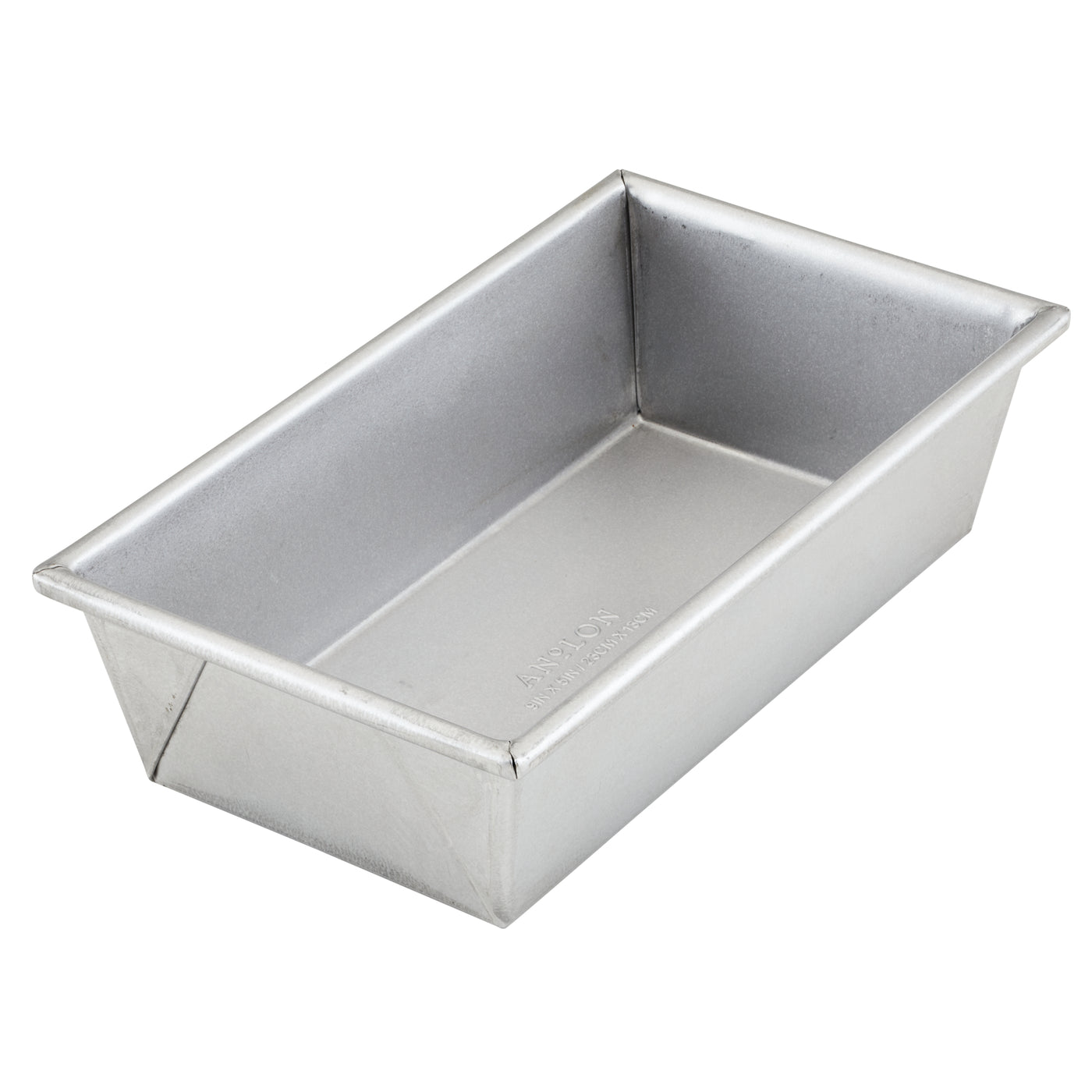 The 9-Inch x 5-Inch Aluminized Steel Loaf Pan by Pro-Bake features uncoated aluminized steel construction with straight sides and a flat base, making it ideal for baking bread. Known for its exceptional heat conduction, this loaf pan has a smooth, matte finish and is oven safe up to 550°F. It is elegantly presented empty against a plain white background.