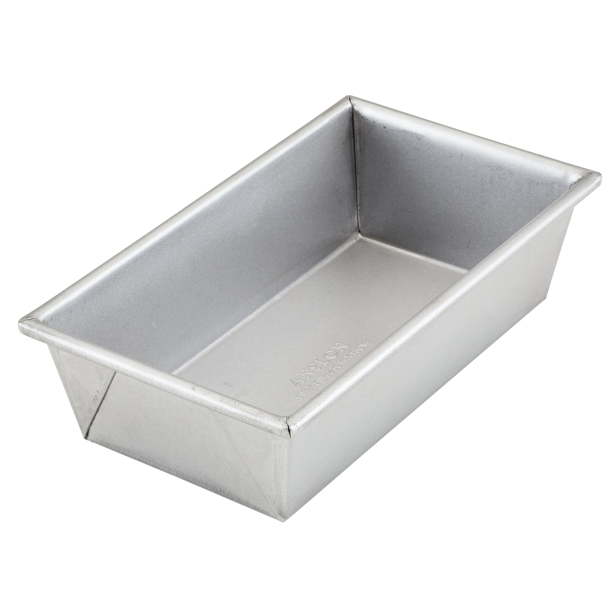 The 9-Inch x 5-Inch Aluminized Steel Loaf Pan by Pro-Bake features uncoated aluminized steel construction with straight sides and a flat base, making it ideal for baking bread. Known for its exceptional heat conduction, this loaf pan has a smooth, matte finish and is oven safe up to 550°F. It is elegantly presented empty against a plain white background.