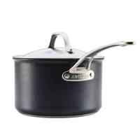 Part of the Anolon X 10-Piece Hybrid Nonstick Cookware Set, this PFOA-free black pot has a glass lid, long silver handle, and the brand name in raised letters on the side. It features a SearTech™ cooking surface and is showcased against a white background.