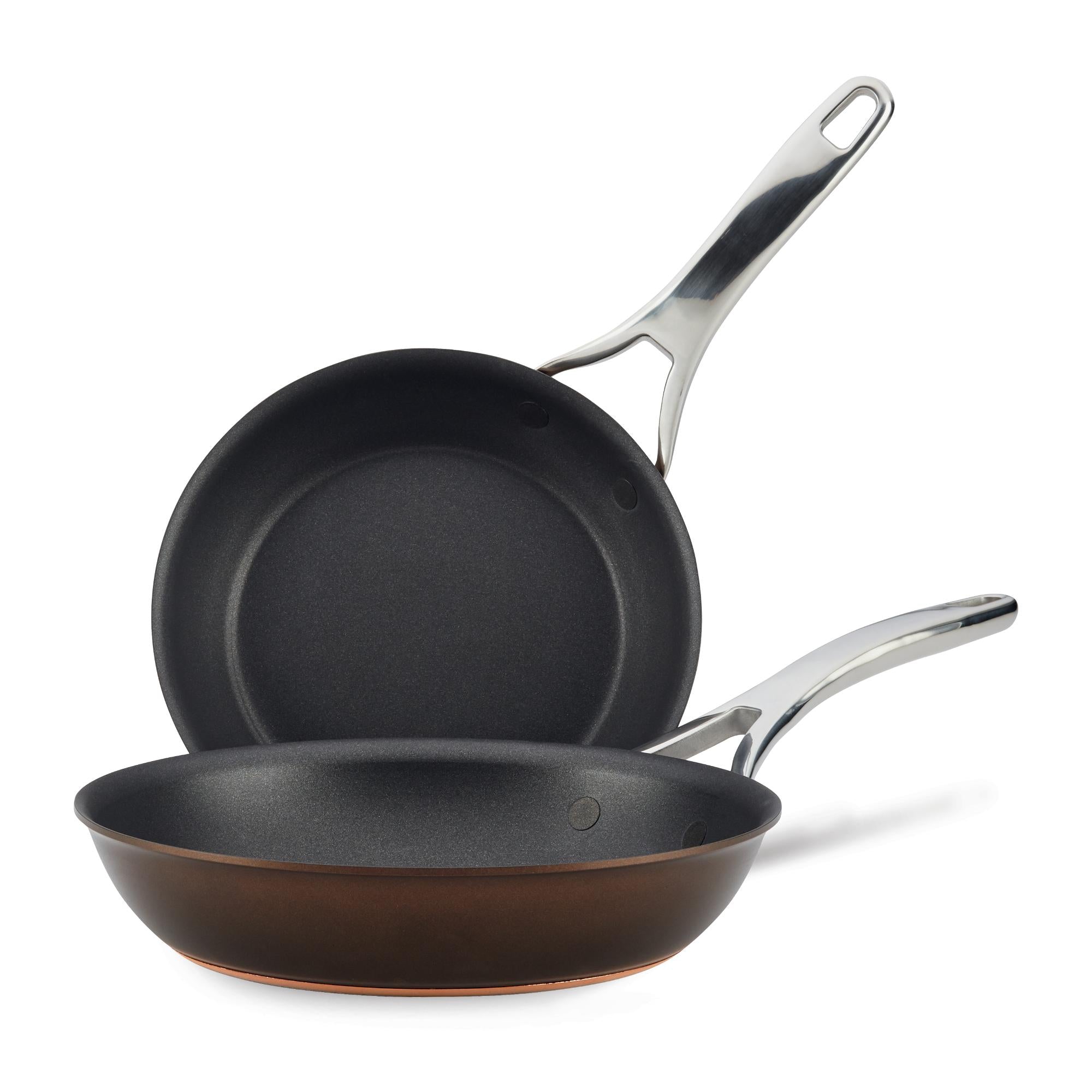 The Nouvelle Luxe 8.5 & 10-Inch Frying Pan Set features two nonstick pans with sleek silver handles and metallic exteriors. Compatible with induction cooktops, they offer both modern style and versatile cooking performance.