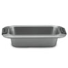 The Advanced 9 x 5-Inch Loaf Pan features wide side handles with black silicone grips, a heavy gauge steel build, and a durable nonstick finish, shown against a white background.