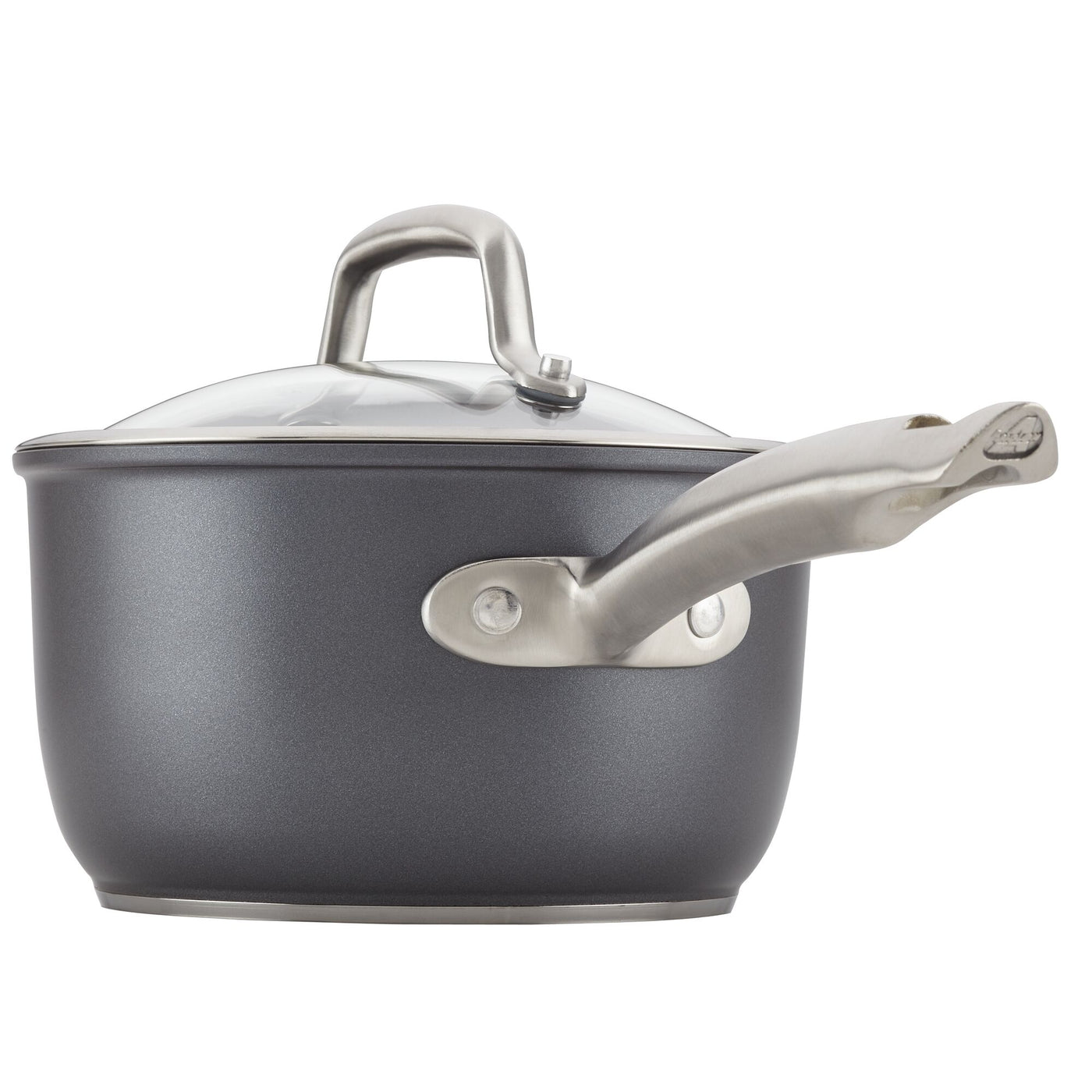 The Accolade 12-Piece Cookware Set includes a stylish, black hard-anodized saucepan equipped with a long ergonomic metallic handle and a matching lid. It stands out against a plain white background and features a triple-layer nonstick surface that provides exceptional cooking performance. Its modern design is also induction suitable, making it versatile for various kitchen needs.
