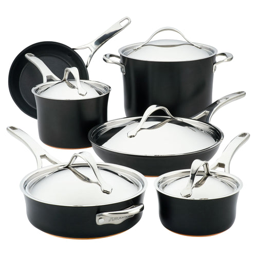Introducing the Nouvelle Luxe 11-Piece Cookware Set, crafted from ultra-tough hard-anodized aluminum in an elegant black and silver with sleek handles and a polished finish. This collection, featuring a variety of pots and pans with lids, is designed for superior performance, all beautifully displayed on a white background.