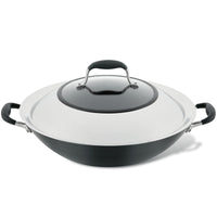 The 14-Inch Wok with Side Handles by Advanced Home is a black and silver masterpiece, featuring sturdy handles on both sides and a knob atop its lid. This hard-anodized flat-bottom wok boasts a nonstick surface, designed for easy handling and efficient cooking.