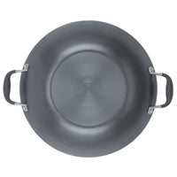 A top-down view of the 14-Inch Wok with Side Handles from Advanced Home presents a round, gray metal cooking pan featuring two side handles. The embossed branding and text on its smooth surface enhance its sleek design, while the silver handles accentuate the elegance of this nonstick, hard-anodized flat bottom wok.