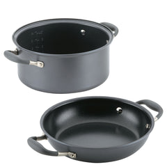 An Advanced Home Round Two Step Meal Set, featuring a sleek 5-quart black hard-anodized non-stick saucepan with handles and a matching lid, is placed separately beside it, similar to a Dutch oven design.