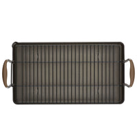 The Advanced Home 10 x 18-Inch Double Burner Griddle, shown from above, features SureGrip tan handles at each short end and comes with a removable multi-purpose rack for comfort and versatility.