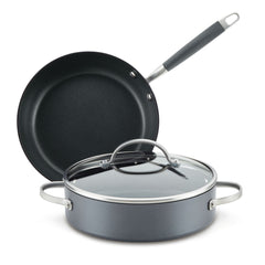 The Advanced Home 3-Piece Nonstick Cookware Set includes a hard-anodized frying pan with a black-grip handle and a lidded sauté pan, both designed for efficient heat distribution. These gray items feature shiny silver rims and side handles, elegantly presented against a white background.