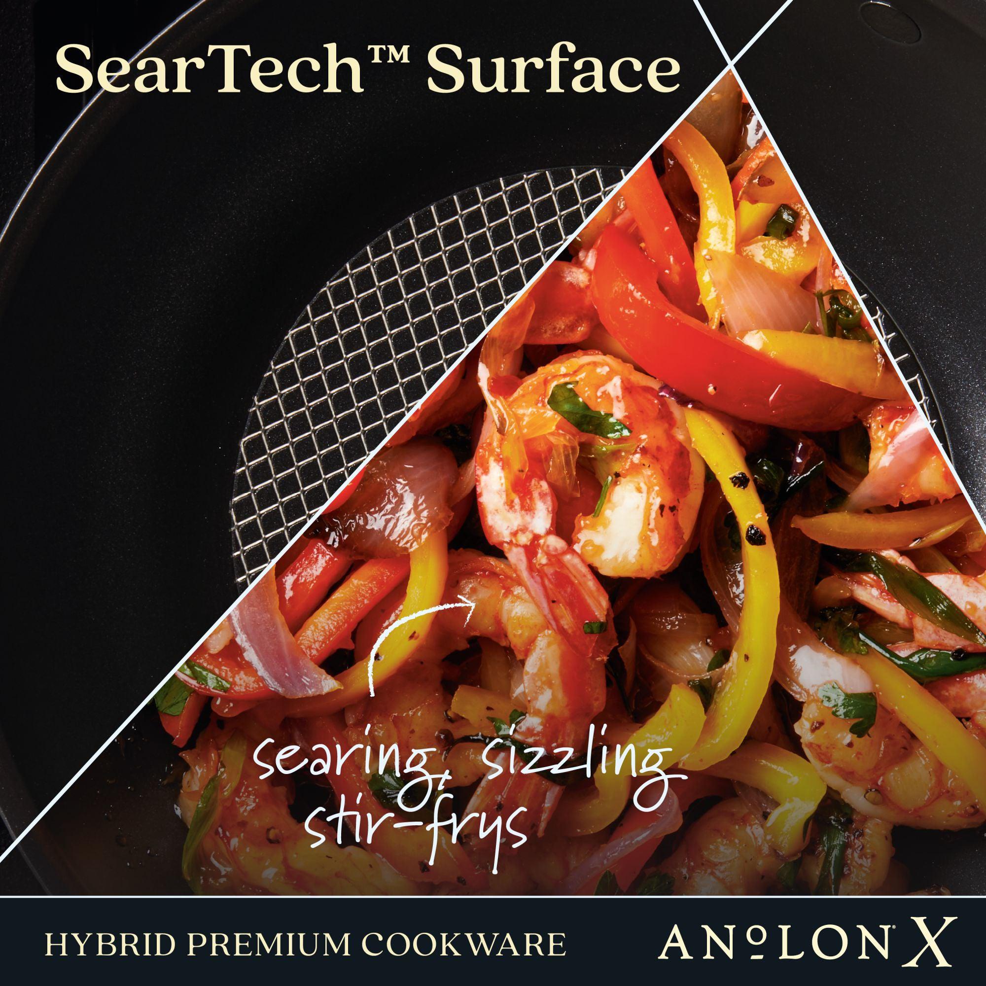 Close-up of a dual image: one side features Anolon Xs 10-Inch Hybrid Nonstick Wok with Lid, showcasing its textured SearTech™ Surface, while the other displays a shrimp stir-fry with bell peppers and onions. Text overlays read “SearTech™ Surface” and “searing, sizzling stir-fries.” Stainless steel base ensures durability.
