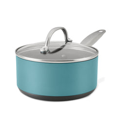 The Achieve 2-Quart Hard Anodized Nonstick Sauce Pan with Lid features a teal design with a sleek black base and sturdy metal handle. It includes a glass lid topped with a silver handle, while its triple-layer nonstick finish enhances both style and practicality, all displayed against a plain white background.