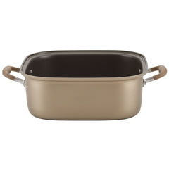 The Square Two Step Meal Set by Advanced Home features a spacious, square baking dish in a gold hue with convenient side handles. Its interior offers outstanding nonstick performance, and the brown-grip handles provide easy handling. This stove-to-oven ready piece is beautifully styled against a plain white background.