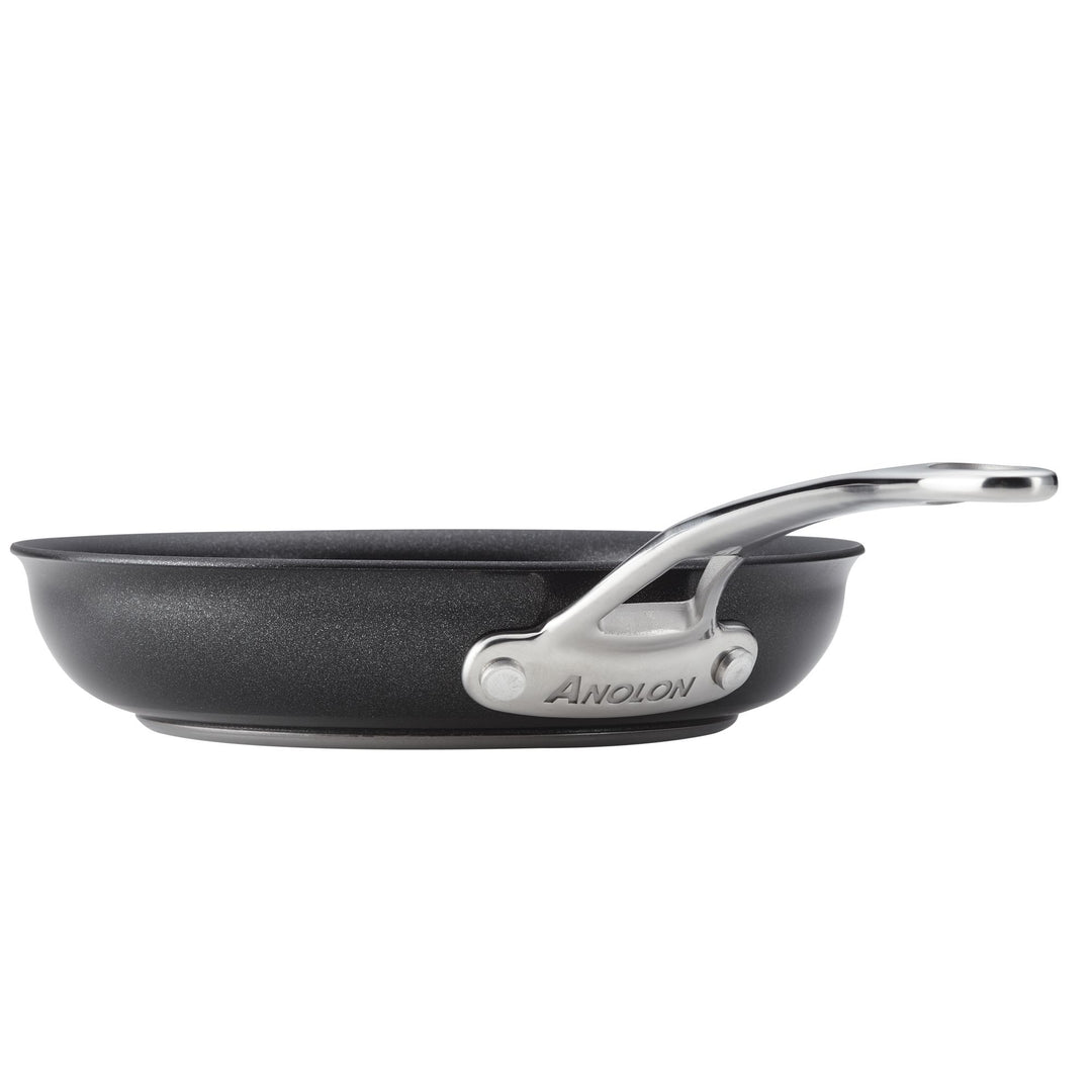 A black nonstick frying pan with a silver handle.