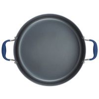 A top-down view of a 7.5-quart stockpot from Advanced Home, featuring a non-stick dark gray interior and two blue handles on either side. This circular stockpot is designed for even heat distribution, making it ideal for cooking.