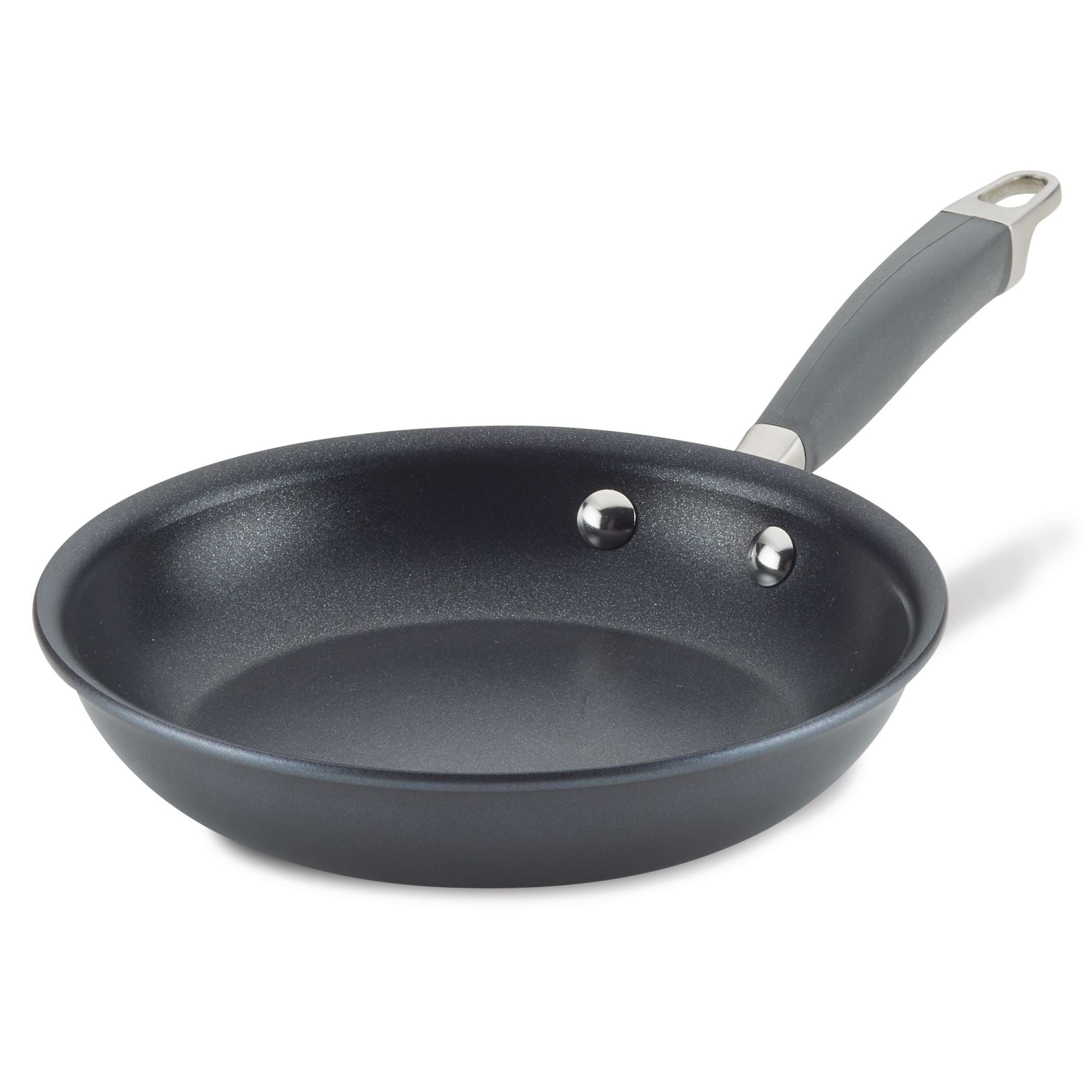 The Advanced Home Frying Pan with a curved handle is displayed. It is empty, set against a white background, and features two rivets securing the handle to the pan.