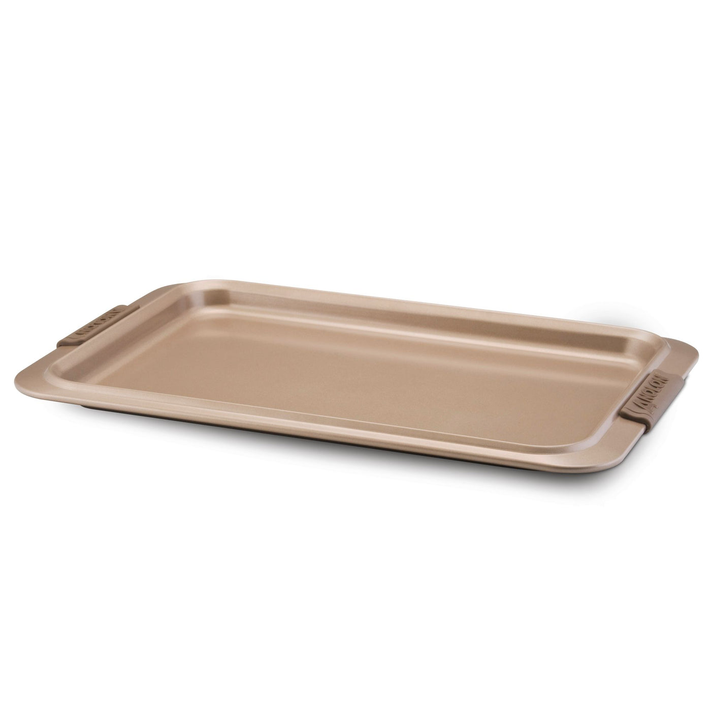 The Cookie Sheet with Silicone Grips by Advanced is a rectangular, non-stick baking sheet featuring silicone grips on its raised edges, presented in a metallic tan color to ensure even heat distribution and displayed against a white background.