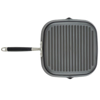 The Advanced Home 11-Inch Deep Square Grill Pan features a nonstick cooking surface with raised ridges and a long black handle, making it ideal for stovetop grilling.