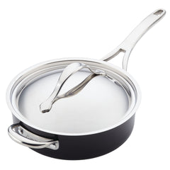 Discover the Nouvelle Luxe 11-Piece Cookware Set, featuring a polished stainless steel saucepan with lid enhanced by copper performance. The saucepan has a gleaming finish, a lengthy handle for ease of use, and an additional smaller handle on the opposite side. The lid sports a curved top handle that seamlessly complements its modern design.