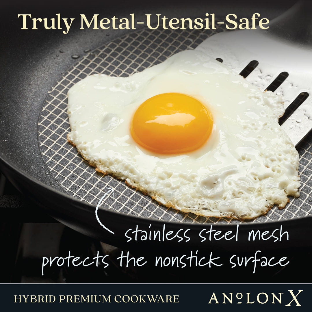 Fried egg on a nonstick pan with a metal spatula, promoting metal-utensil-safe cookware.