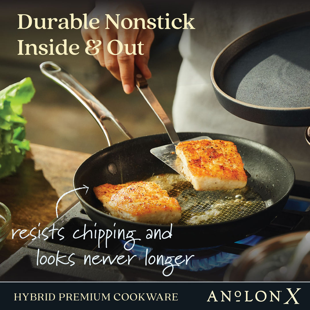 Person cooking fish fillet on a nonstick pan, promoting durable hybrid premium cookware.