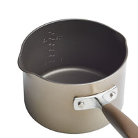 The 2-Quart Straining Saucepan by Advanced Home is a hard-anodized, nonstick saucepan with interior measurement markings. Designed for precision cooking, it boasts a sturdy metallic handle and a matte finish exterior.