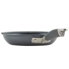 The 11-Piece Cookware Set by Advanced Home features a side view of a gray frying pan crafted from hard anodized aluminum with a stylish silver handle. This nonstick cookware showcases a smooth surface and sleek design, ideal for cooking. The handle is securely attached with two rivets, making it an essential piece in your kitchen collection.