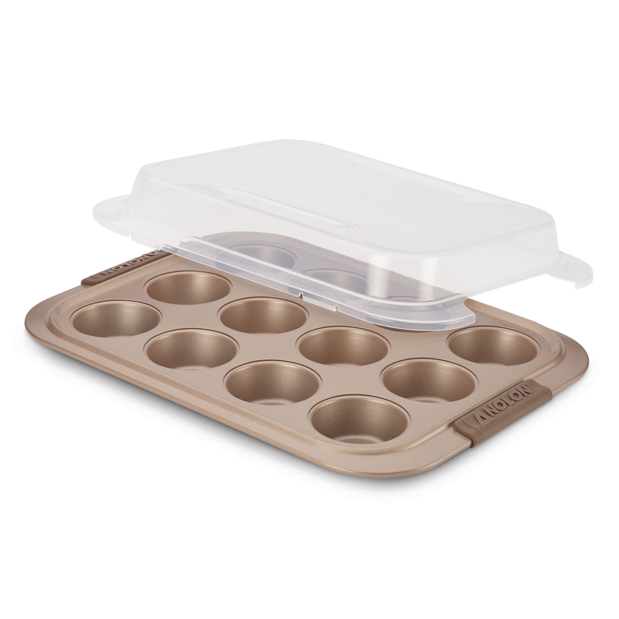 A gold nonstick Muffin Pan with Lid from Advanced, crafted from heavy gauge steel construction, features twelve cups and comes with a clear plastic lid that is partially ajar, offering a peek inside. The brand name is embossed on the edge of the tin, guaranteeing perfect baked goods every time.