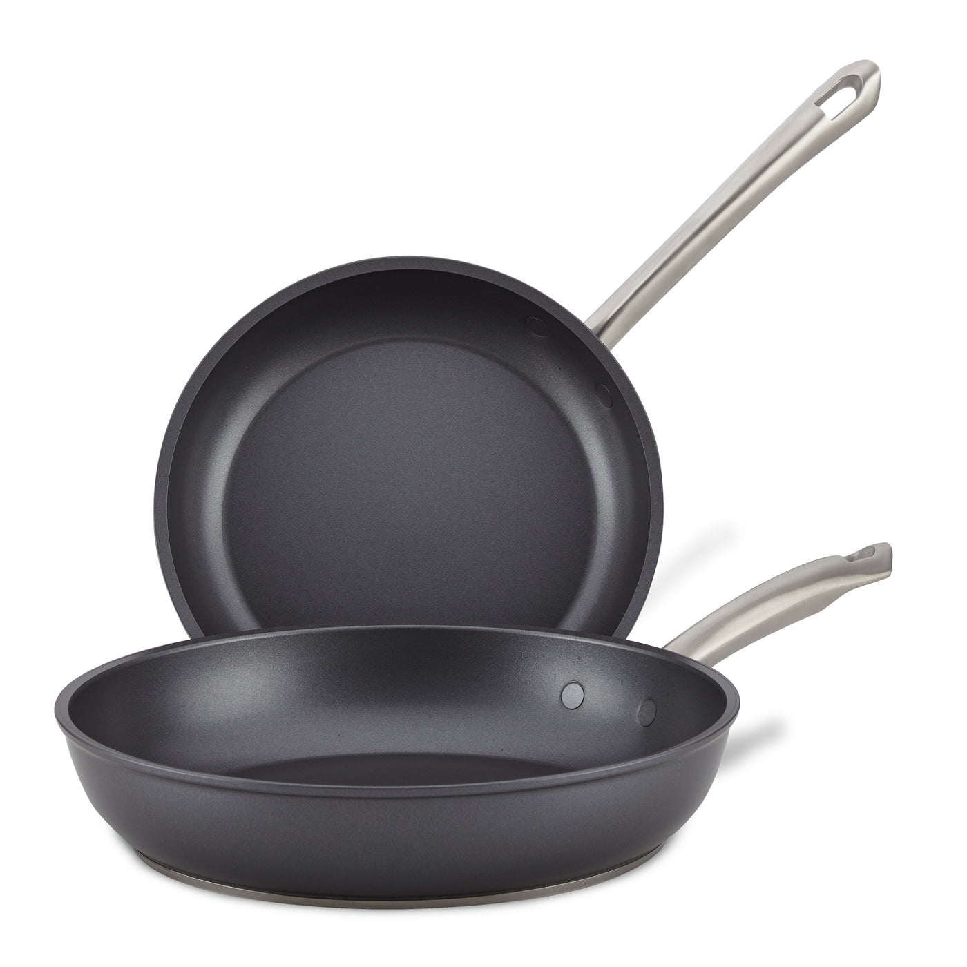 The Accolade 10 & 12-Inch Frying Pan Set features two sapphire-reinforced nonstick pans with metal handles; one pan lies flat as the other stands behind it, showcasing their precision forged interiors.