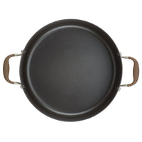 A 7.5-quart stockpot with brown handles on either side, seen from above. The stockpot boasts excellent heat distribution with its smooth, dark interior surface and slightly raised edge.