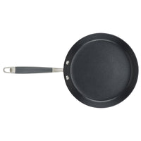 The 9.5-Inch Crepe Pan from Advanced Home, featuring a black non-stick surface and a grey handle, is shown from above on a white background and guarantees effortless cooking.