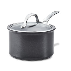 The AnolonX 3-Quart Hybrid Nonstick Saucepan With Lid is gracefully presented against a white background, featuring a sleek black design with a glass lid and stainless steel handle. Made from ultra-durable nonstick material for extended use, it also offers the convenience of being dishwasher safe.