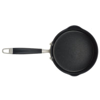 A robust black frying pan, known for its hard-anodized durability, featuring a metal handle and black grip. The Advanced Home 2-Quart Straining Saucepan is pictured from above on a white background.