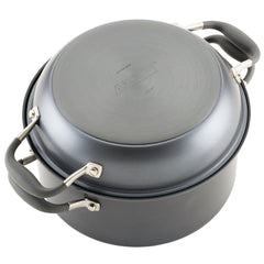 A gray 5-Quart Dutch oven from Advanced Home's Round Two Step Meal Set comes with a secured lid and features rubberized handles. The pot, showcasing its circular base and visible branding, is made from hard-anodized material and is placed upside down to emphasize its sturdy design and durability.