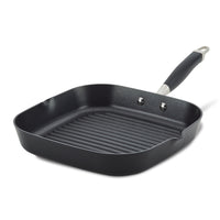 An 11-Inch Deep Square Grill Pan by Advanced Home featuring a black, nonstick ridged cooking surface and a metallic handle with a black grip. The pan's high sides make it ideal for stovetop use.