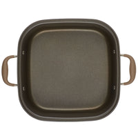 Introducing the Square Two Step Meal Set from Advanced Home. This square non-stick frying pan boasts exceptional nonstick performance and features stylish brown handles on each side. Its interior showcases a dark, smooth surface that perfectly complements the lighter brown handles, making it an ideal addition to any kitchen. Displayed against a white background, this pan is both functional and visually appealing.