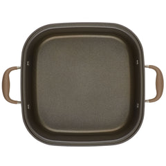 Introducing the Square Two Step Meal Set from Advanced Home. This square non-stick frying pan boasts exceptional nonstick performance and features stylish brown handles on each side. Its interior showcases a dark, smooth surface that perfectly complements the lighter brown handles, making it an ideal addition to any kitchen. Displayed against a white background, this pan is both functional and visually appealing.