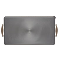 The Advanced Home 10 x 18-Inch Double Burner Griddle with Multi-Purpose Rack features SureGrip handles, a sleek brushed metal surface, and a centered logo, shown here from above.