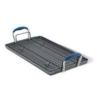 The Advanced Home 10 x 18-Inch Double Burner Griddle features a multi-purpose rack and two blue SureGrip handles, displayed on a white background.